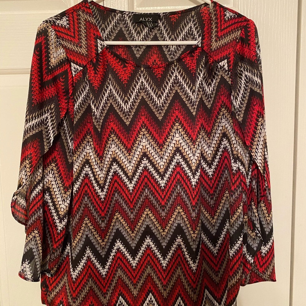 Blouse with open sleeves